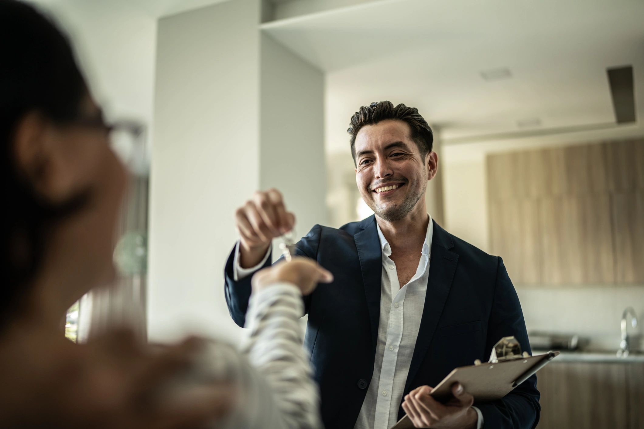 Tenant receiving keys from leasing agent