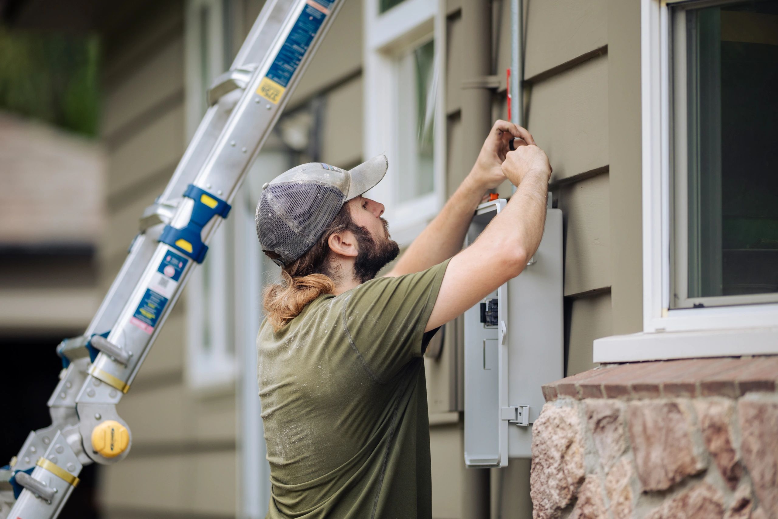 Electrician working on an electrical panel